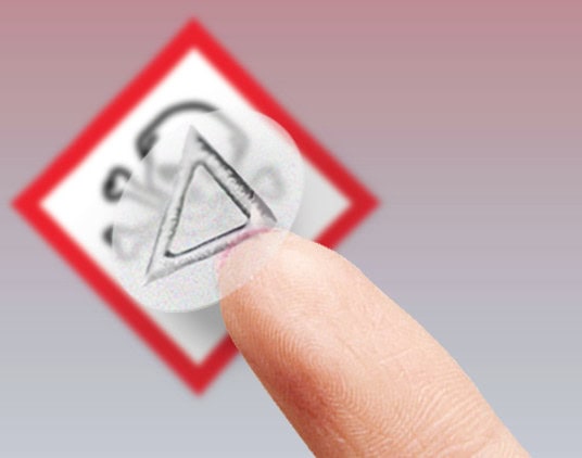 Tactile warning label